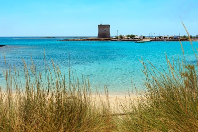Picturesque Torre Chianca beach and historical fortification tower Torre Chianca (Torre Santo Stefano) on Salento Ionian sea coast, Porto Cesareo, Puglia, Italy